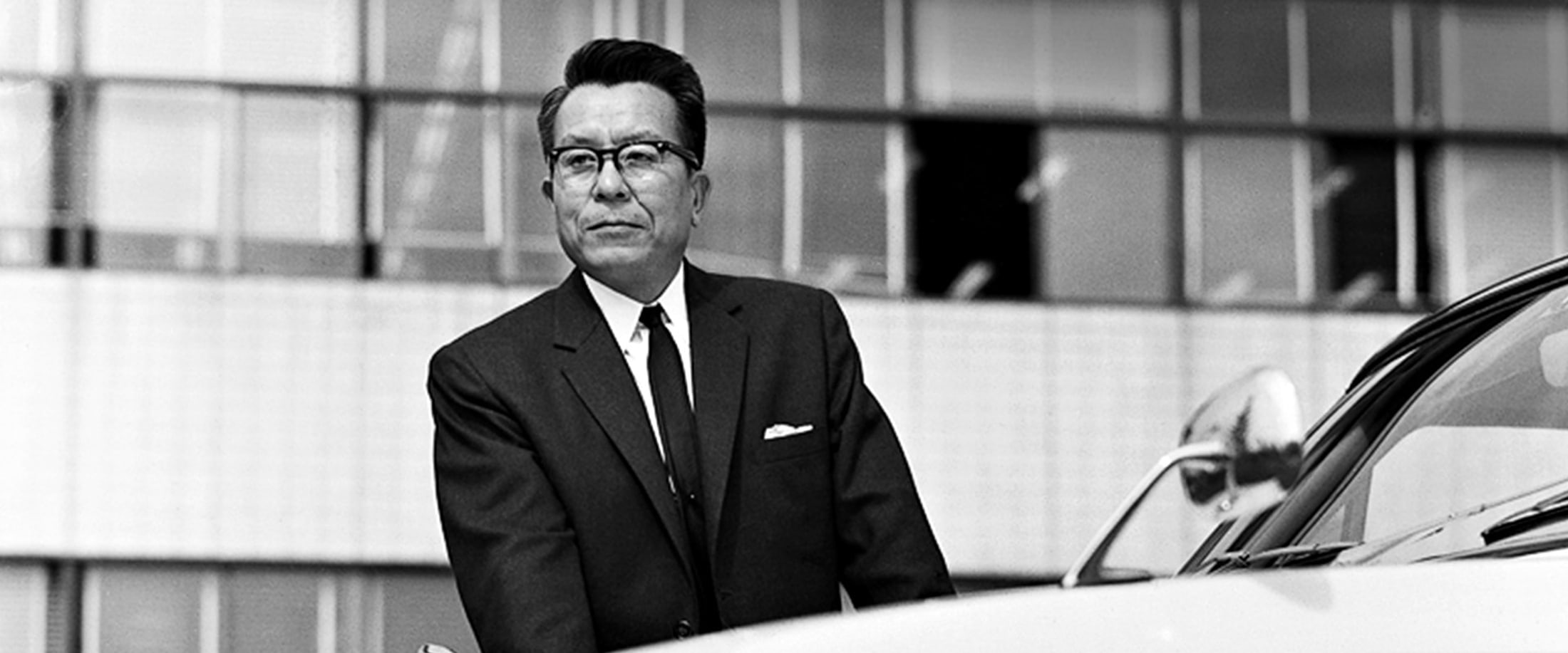 Tatsuo Hasegawa, Toyota chief engineer, photographed beside one of his cars