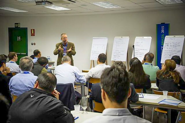 Art Smalley leading a lean workshop with flip charts and training materials